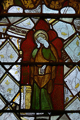 C14 stained glass fragment of saint.